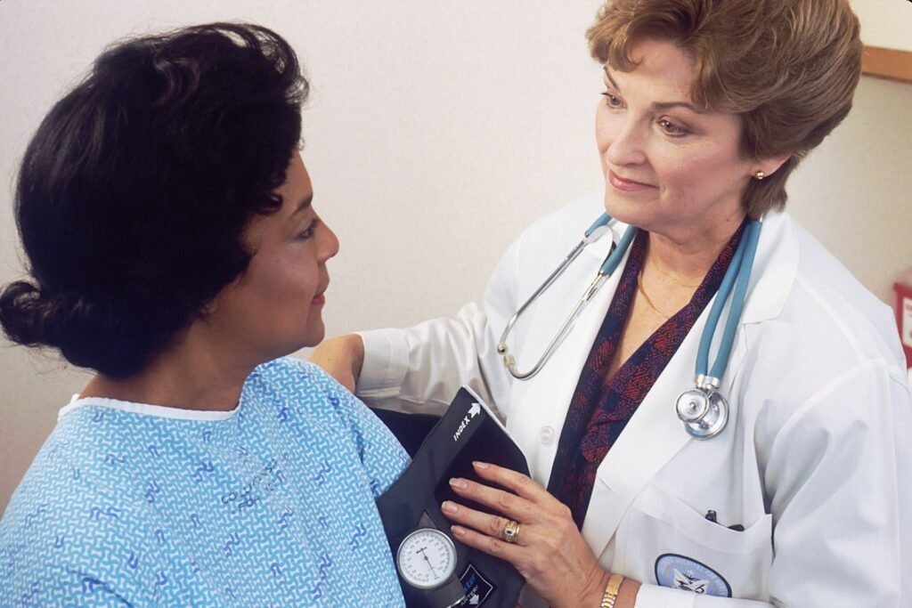 Preconception Health Care - 1 a woman with a stethoscope talking to another woman